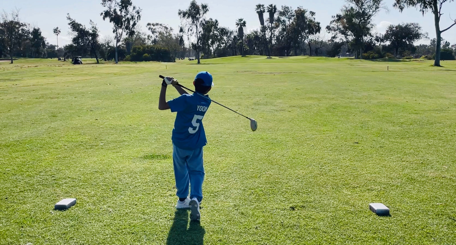 golfer posing at golf course on the tee in san diego