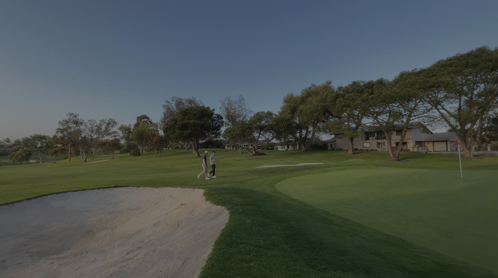 Country Club Rancho Bernardo Golf Course in San Diego. Jacob walking with his student on the second green.